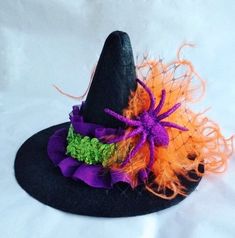 a black hat with orange and green decorations