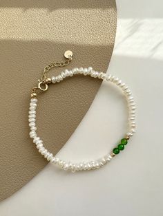 "✿ Sold individually ✿ Material: 3-4mm Natural Freshwater Pearls  2-3mm Natural Diopside ✿ Finish: 14K Gold Filled Fingdings ✿ Size: Approx. 5 5/8 inches with 1 inches adjuster ✿Tarnish resistant, hypoallergenic, safe for sensitive skin ✿Shop the collection: https://www.etsy.com/listing/1382755555/ ✿ P L E A S E   N O T E: All of our freshwater pearls are all-natural and unique, therefore each shape is slightly different and won't exactly be like in the picture.  Meanwhile, there may be measurem Elegant Green Pearl Hand-strung Bracelet, Elegant Green Hand-strung Pearl Bracelet, Elegant Hand-strung May Birthstone Beaded Bracelets, Elegant Hand-strung May Birthstone Bracelets, Elegant May Birthstone Bracelets, Green Gemstone Bracelet, Gold Layered Bracelets, Layered Bracelet, Gold Baroque