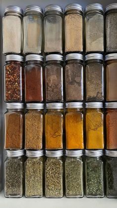 many jars filled with different types of spices