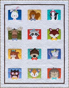 a quilted wall hanging with different animals on it's sides and squares in the middle