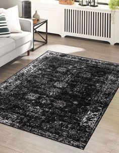 a black and white rug in a living room