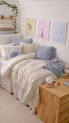 a bed sitting in a bedroom next to a wooden dresser and white wall with ivy growing on it