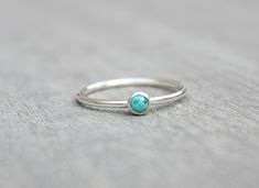 Beautiful December birthstone stacking ring. Made in .925 sterling silver and stone is a 3mm genuine turquoise. This ring is made to order in your size. If you don't see your size available please feel free to message me. All orders ship in a gift box. If you are ordering multiple items and want them boxed separately, please let me know in the notes at checkout. I ship via USPS. Please review the estimated delivery date and processing times. Processing times vary based on how busy my shop is at Minimalist Sterling Silver Turquoise Promise Ring, Silver Turquoise Ring Round Band For Gift, Minimalist Silver Turquoise Promise Ring, Turquoise Gemstone Stackable Rings In Sterling Silver, Stackable Sterling Silver Turquoise Ring, Minimalist Silver Stackable Turquoise Ring, Minimalist Silver Turquoise Stackable Ring, Stackable Turquoise Ring Gift, Minimalist Stackable Turquoise Silver Ring