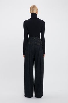 A highlight from the AW24 runway, the Cargo Jean has a flattering high waist and a relaxed low-slung crotch for a laid-back off-duty look. Side seam pockets and an adjustable buckle fastening at the back waist strengthen the utilitarian vibe. Tobacco topstitching adds a traditional finishing touch. Styled with the Half Zip High Neck Top Victoria Beckham Cargo Jean In Dark Indigo Rinse  - Size 28 UK Aw24 Runway, High Neck Top, Dark Indigo, Cargo Jeans, Off Duty, Victoria Beckham, Half Zip, High Neck, High Waist