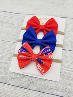 This pack of 3 headbands is perfect for the Bills fan in your life! The nylon headbands will fit babies and toddlers of all ages, or choose alligator clips for little ones with more hair! Since each bow is handmade, there may be some slight differences in sizing and pattern placement.  Package includes: Red Blue Bills print Small bows measure approximately 3.5" x 2.5" Thank you so much for visiting  my shop! Don't hesitate to contact me with any questions or concerns. Red Blue Hair, Blue Bills, Blue Hair Bows, Bow Baby Shower, Fabric Hair Bows, Alligator Clips, Small Bows, Nylon Headbands, Buffalo Bills