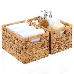 two wicker baskets with towels and soap in them