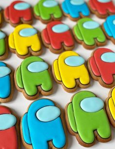 decorated cookies are arranged in the shape of elephants