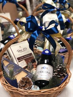 a basket filled with wine and chocolates