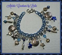 Beach Charm Bracelet in Blue by ArtCreationsbyLeslie on Etsy Beach Charm Bracelet, Beachy Bracelets, Resort Jewelry, African Bracelets, Beachy Jewelry, Boho Wrap Bracelet, Filigree Bracelet, Starfish Bracelet, Beach Bracelets