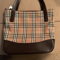 Authentic Burberry Nova Check Back With Dark Brown Handles. Like New Condition, No Scratches Or Discoloration On The Outside Or Inside. Burberry Canvas Bag, Burberry Nova Check Bag, Shoulder Bags, Dark Brown, Like New, Burberry, Bag Lady, Handles, Shoulder Bag