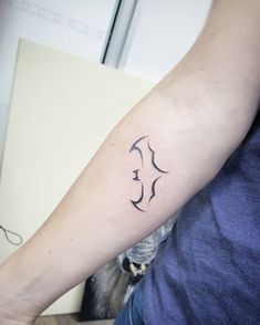 a person with a tattoo on their arm