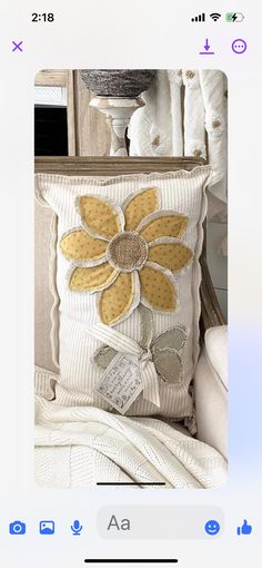 a white pillow with yellow flowers on it