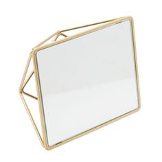 a mirror sitting on top of a white surface