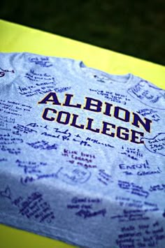 a table with writing on it that reads albinon college