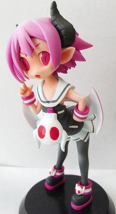 an anime figurine is posed on a black base with white and pink hair