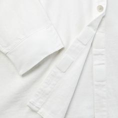 Take on your day with confidence and effortless style with this Long-Sleeve Adaptive Button-Down Shirt from Universal Thread™. This shirt is designed with side slits with hook-and-loop closures to allow for a better fit for the seated guest. Made from 1x1 rib canvas cotton-blend fabric, it features a collared neck, chest patch pocket and turnback hem for touches of timeless style. Wheelchair Friendly or Seated Fit products are intended for someone who uses a wheelchair, someone who is not ambula White Tops With Fold Down Collar For Daywear, Collared Shirt With Buttons For Loungewear, Everyday Tops With Button Closure And Spread Collar, White Effortless Collared Top, Casual White Top With Fold Down Collar, Effortless Daywear Top With Spread Collar, Tops With Placket And Shirttail Hem For Daywear, White Effortless Shirt With Shirttail Hem, Everyday Button-up Top With Placket