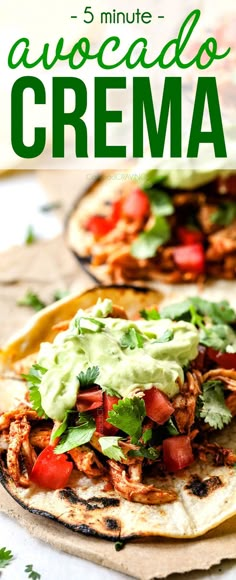 two tortillas with guacamole, tomatoes and cilantro on top