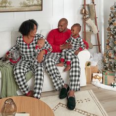 Matching Christmas pajamas for the whole family are here! This super soft pajama set for dad will get him set for the holiday season. The black and white checkered pants feature a straight leg with stretch waistband secured with drawstring, while the partial button-down, long sleeve red shirt matches perfectly, giving him the perfect warm top to wear around the house. This is part of a matching family Christmas pajama style, with styles for mom, dad, babies and toddlers, as well as a pet bandana Buffalo Plaid Pajamas, Matching Family Christmas Pajamas, Baby Size Chart, Christmas Jammies, Checker Pattern, Pyjamas Womens, Matching Christmas Pajamas, Red Highlights, Christmas Pajama Set