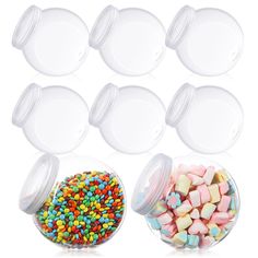 six clear plastic containers filled with candy and sprinkles next to each other