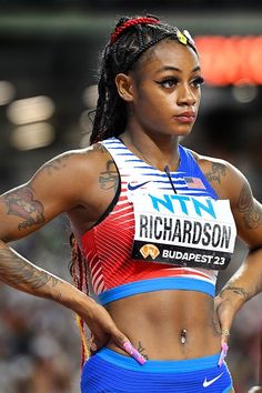 a female athlete with tattoos on her arms