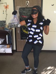 a woman wearing a mask and black shirt