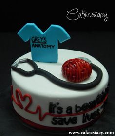 a birthday cake with a stethoscope and t - shirt for grey's anatomy