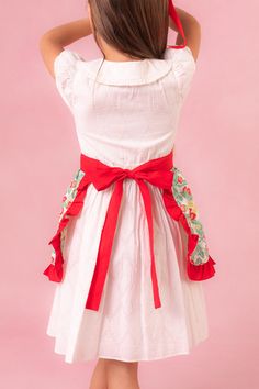 Say hello to the Mini Ivy Half Apron in Strawberry Cotton - a charming blend of functionality & fun for your summer kitchen adventures! Made for making magical memories in the kitchen with those you love! Full of a delightful green, red, yellow, & cream cotton fabric sprinkled with sweet strawberry prints! Its features front pockets & a darling red ruffled hem, adding a pop of color & flair to your culinary masterpieces! With its easy tie-back closure, our half apron ensures both style & practic Strawberry Prints, Half Apron, Summer Kitchen, Strawberry Print, Yellow Cream, Matches Fashion, Red Yellow, The Kitchen, Ivy