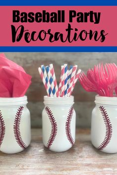 three baseball themed mason jars with paper straws in them and the words baseball party decorations