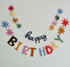 a happy birthday banner hanging from a string with stars and letters that say papapi's birthday