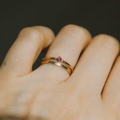 July’s birthstone - tiny ruby ring on our signature bark texture 14k yellow gold band. Dainty, delicate beauty. Perfect a lady who is not a fan of chunky gemstones, this ring won't get tangled in your clothes or hair. Match perfectly when you wear it with our dainty rings. Made of 14K yellow gold. Genuine ruby size 2 mm. Band width approximately 1.2 mm. Dainty Ruby Ring, Rubellite Ring, Ruby Solitaire Ring, Tiny Diamond Ring, Bark Texture, Dainty Rings, Delicate Beauty, Tiny Diamond, Ruby Jewelry