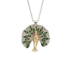 The Peacock Necklace in 18K gold and oxidized silver is decorated with tsavorite garnets.Peacock necklace serial number T220● green tsavorite: 0.95 cttw● 18K yellow gold and sterling silver Green Peacock Design Necklace As A Gift, Elegant Green Necklace With Peacock Design, Green Peacock Design Jewelry Gift, Peacock Necklace, The Peacock, Saved Items, Oxidized Silver, Sterling Silver Necklaces, Necklace Lengths