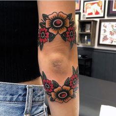 a woman's arm with flowers on it