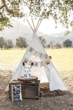 a teepee with the words wild one on it