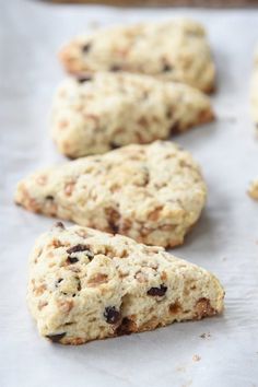 some cookies are laying on a piece of parchment paper