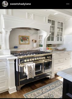 a kitchen with an oven, stove and cabinets in it's center island area