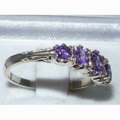 *This five stone ring is made from 417  10K (10ct 10Kt) White Gold prong setting with Genuine Natural Semi-precious Amethyst.This stunning ring has been set with a selection of Amethysts, measuring 4 mm, 3 mm & 2.75 mm (0.16",0.12" & 0.11") set in this Solid English 10k White Gold Antique style setting.  These are Natural Amethysts, Vibrant Purple which Stand out wonderfully set against the polished 10k White Gold.The Quality of this piece is Superb, the Amethysts have each been specific Elegant Three Stone Amethyst Ring For Gift, Elegant Three Stone Amethyst Ring As Gift, Classic Three Stone Amethyst Ring For Formal Occasions, Classic Multi-stone Purple Amethyst Ring, Classic Silver Amethyst Ring With Multi-stone, Round Amethyst Three Stone Promise Ring, Round Three-stone Amethyst Promise Ring, Round Three Stone Amethyst Promise Ring, Classic Purple Multi-stone Amethyst Ring