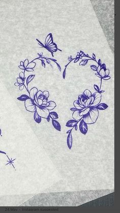 two pieces of paper with blue flowers and butterflies on them, next to each other