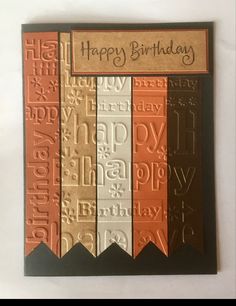 a happy birthday card with different types of letters and numbers on the front, along with an orange ribbon that says happy birthday