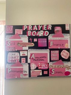 a bulletin board with pink and black stickers on it