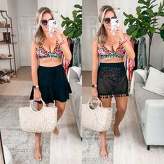 a woman taking a selfie in her living room wearing a crop top and skirt