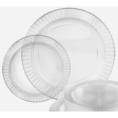 three clear plastic plates and one empty glass plate