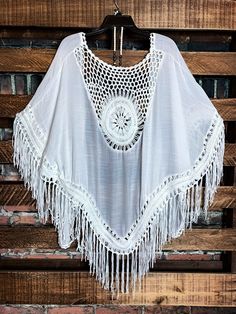 One Size (Fit up to 2X) Crochet Peasant Hand Wash Cold Wash 65% Polyester 35% Cotton Measurements Approx.;Back Length: 44/45 "(including tassel-Fringe)Bust Across: 48/49 " (including both side tassels-Fringe)Armhole: 14/14.5 " Tassel Length: 9/9.5 " ***Jewelry & Slip Sold Separately Extender top slip title; FULL OF GRACE LACE SLIP DRESS EXTENDER TOP IN IVORY White Free Size Cover-up For Festivals, White Free Size Festival Cover-up, White Bohemian Cover-up For Festivals, Bohemian White Cover-up For Festival, White V-neck Kimono For Festival, White Bohemian Free Size Cover-up, White Bohemian Free-size Cover-up, White Casual Festival Cover-up, Casual White Kimono For Festival