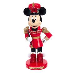 a mickey mouse figurine wearing a red uniform