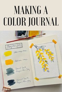 an open book with watercolors on it and the title, making a color journal