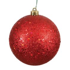 a red christmas ornament hanging from a string