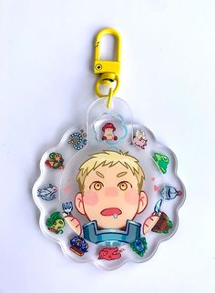 a plastic keychain with an image of a boy on it