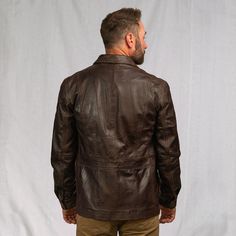 Inspired by the old west ranchers who made their mark at the base of the Bighorns… the Sheridan Barn Coat delivers enduring quality worthy of the pioneers of the past, tailored with a modern fit for the present. Outfitted with 100% full-grain lambskin leather, the Sheridan is secured by a top-to-bottom zipper concealed beneath distressed antique brass buttons, shielding an easy-clean lining that offers ample comfort and utility from sunup to sundown. Twin button-flap pockets at the side and one Old Leather Jacket, Dark Brown Leather Jacket, Barn Coat, Heavy Clothing, Lambskin Leather Jacket, Leather Duffle Bag, Leather Jacket Style, Leather Duffle, Vintage Leather Jacket