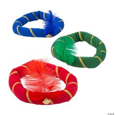 three different colored feathers are in the shape of bracelets