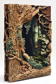 an intricately carved photo frame with trees and leaves