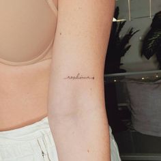 a woman's arm with a tattoo that reads, rejuvena on it